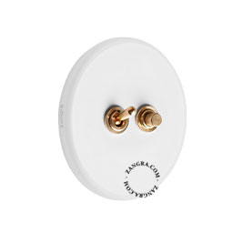 Round white porcelain light switch.