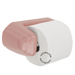 Pink porcelain toilet paper holder.