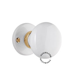 Doorknob in white porcelain and brass.