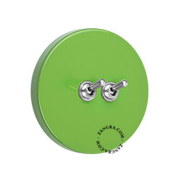 Round green double light switch.