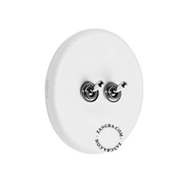 Round white porcelain light switch.