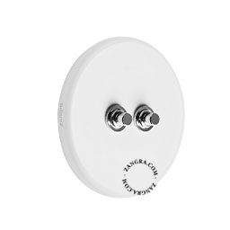 Round white porcelain light switch.