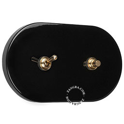 double interrupteur noir avec bouton poussoir et levier en laiton brut couleur or