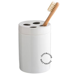 White porcelain cup with 4-hole lid for toothbrush.
