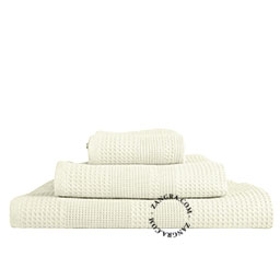 Beige honeycomb bath towel.