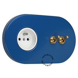 Blue flush mount outlet & switch with double raw brass toggle.