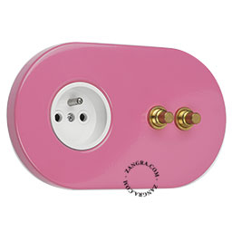 2 gold push buttons on pink integrated outlet