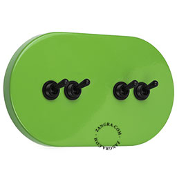 Large green ovale light switch with 4 black levers.