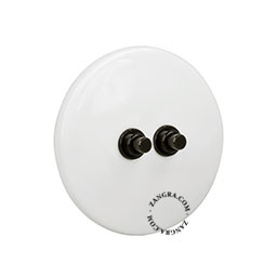 White porcelain switch with double black pushbuttons.