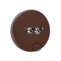 Round brown double light switch.