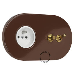 Brown flush mount outlet with switch & pushbutton in brass.