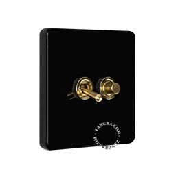 Black porcelain square-shaped switch.