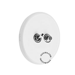 Round white porcelain light switch.