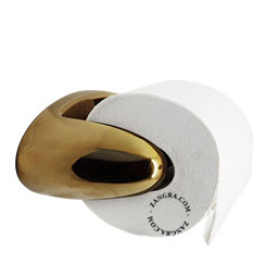 Gold-coloured ceramic toilet paper holder.