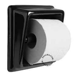 Recessed toilet paper dispenser in black porcelain.