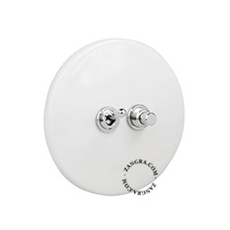 White porcelain switch with nickel-plated toggle switch & pushbutton.