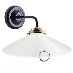 Black wall light with opaline glass shade.