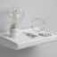 white ceramic wall shelf with integrated white light