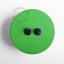 Round green light switch and pushbutton.