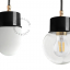 Black pendant light with glass shade.