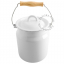 Small compost bin in white enamel with wooden handle.