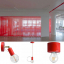 Red pendant light with light bulb.