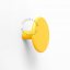 round yellow wall hook or door knob