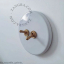 Round white porcelain light switch.