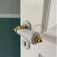door lever in white porcelain and brass