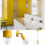 Yellow pendant light with exposed light bulb.