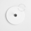 Round white porcelain light switch.