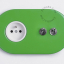 Green outlet & switch with toggle.