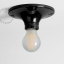 Black porcelain round light fixture.