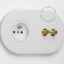 2 gold push buttons on white integrated outlet
