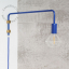 Blue wall lamp with swing arm.
