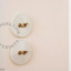 Round white porcelain light switch.