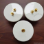 Round white porcelain light switch.