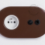 Brown flush mount outlet with toggle switch & pushbutton.