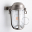 Silvery marine wall light for bathroom or outdoor use.