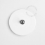 Round white porcelain light switch.