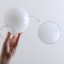 White porcelain wall or ceiling light with glass shade.
