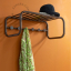 Retro coat rack with hat shelf.
