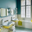 White porcelain light with glass globe for bathroom or outdoor use.