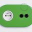 green flush mount outlet & two-way or simple switch – double black toggle