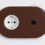 Brown flush mount outlet & switch with black toggle.