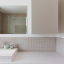 Round white porcelain light switch.