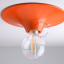 round orange wall or ceiling light