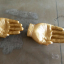 Hand-shaped golden trinket bowl.