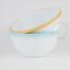 White enamel bowl with caramel yellow rim.