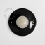 Black porcelain round light fixture.